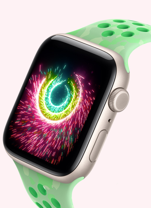 Apple Watch SE 3, aluminium case, starlight colour, Activity rings sparking like fireworks, volt splash Nike Sport Band