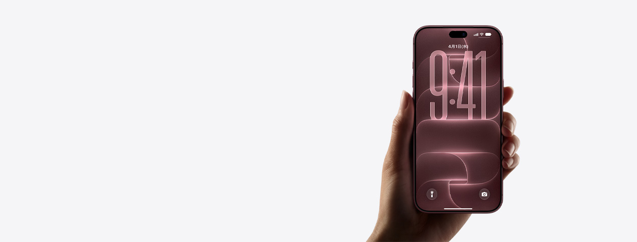 片手に持ったバーガンディ（ダークレッド）のiPhone 18 Pro、前面の外観、デフォルトのロック画面