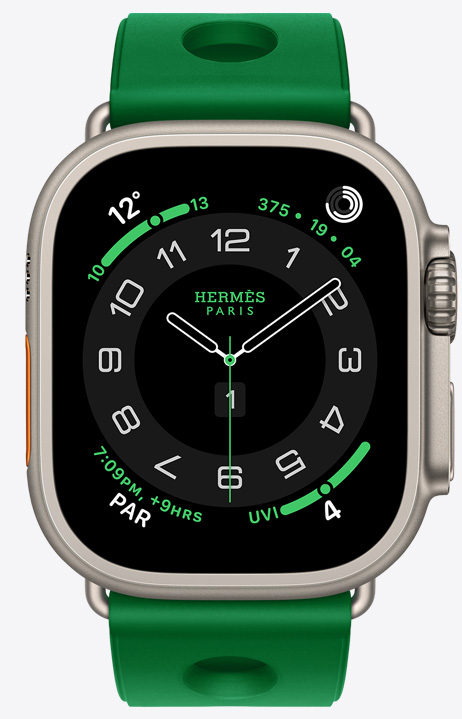 ساعة Apple Watch Hermès Ultra 4، واجهة الساعة بعقارب Circulaire، (عقارب الساعة والدقيقة والثانية، الإضافات: الطقس، وحلقات النشاط، والوقت في باريس، ومؤشر الأشعة فوق البنفسجية)، إطار تيتانيوم، لون طبيعي، الجهة الخارجية اليمنى، التاج الرقمي، زر جانبي نافر، مقترنة بحزام Scub'H Diving، لون Vert Vertigo (أخضر ساطع)، مطاط مقولب، فتحات دائرية في الوسط