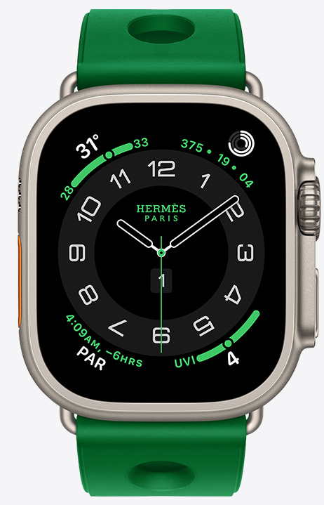 Apple Watch Hermès Ultra 4, Circulaire analog watch face, (hour, minute and second hands, complications: Weather, Activity rings, Paris time and UV index), titanium case, natural color, right side exterior, Digital Crown, raised side button, paired with Scub'H Diving band, Vert Vertigo color (bright green), molded rubber material, circular cutouts centered