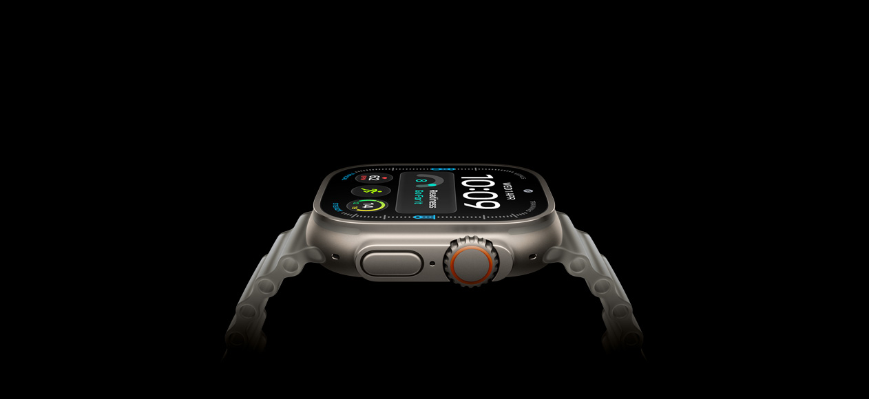 Apple Watch Ultra 4, titanium case, natural color, right exterior, Digital Crown, raised side button, digital watch face, translucent gray Ocean Band