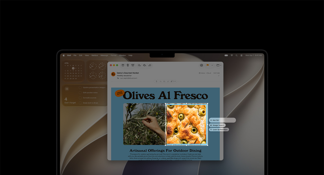 MacBook Pro 14 cali w kolorze gwiezdnej czerni. Na ekranie demo funkcji Inteligencja wizualna: mail ze zdjęciami jedzenia i ziół. Zdjęcie ciasta z oliwkami jest wzięte w ramkę, widzimy trzy sugestie do wybranego obrazu: Ask Siri, Image Search, Look Up Nutrition