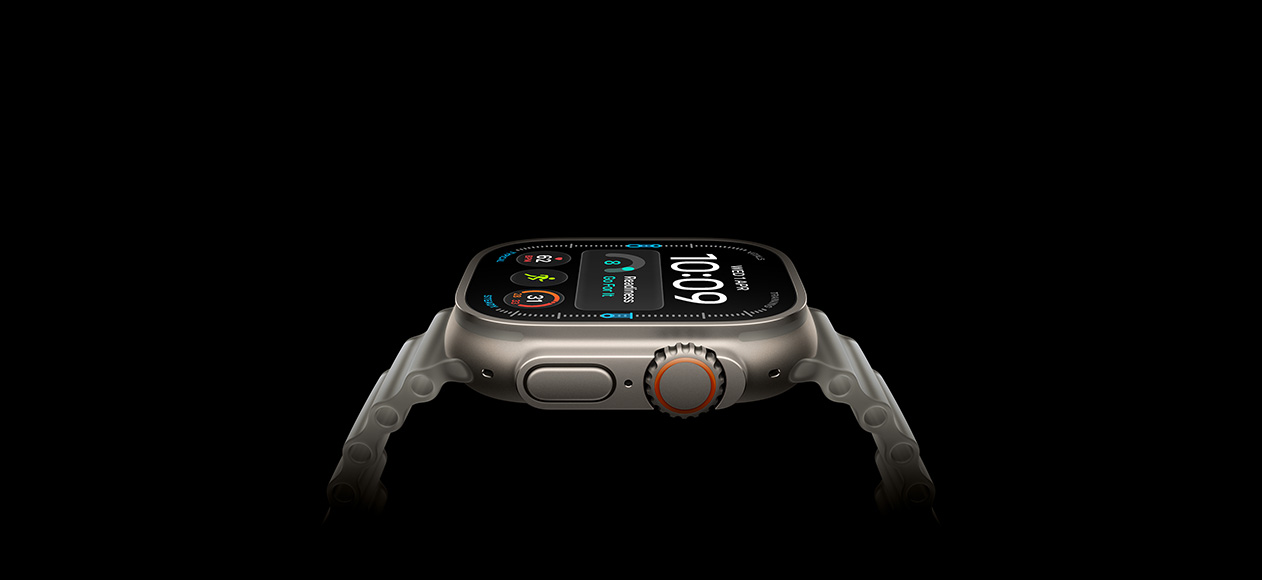 Apple Watch Ultra 4, titanium case, natural color, right exterior, Digital Crown, raised side button, digital watch face, translucent gray Ocean Band