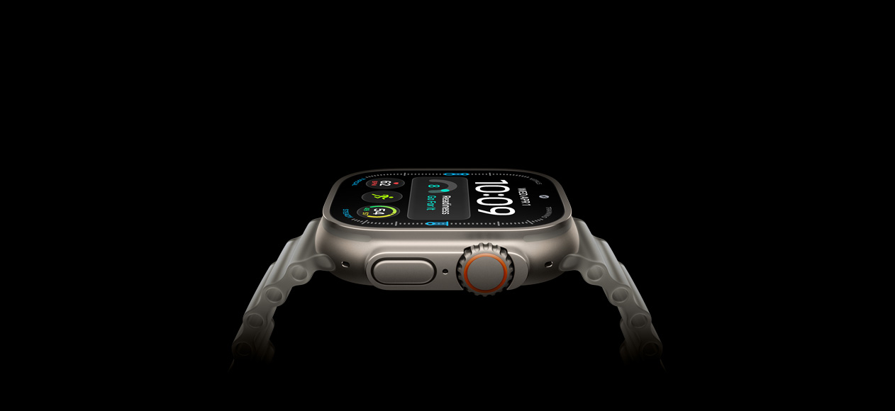 Apple Watch Ultra 4, titanium case, natural color, right exterior, Digital Crown, raised side button, digital watch face, translucent gray Ocean Band
