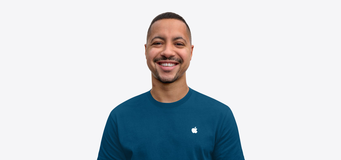 Apple Specialist smiling with an approachable demeanor