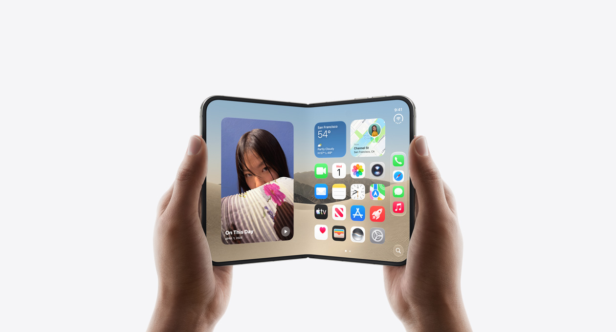 iPhone Duo, held by two hands in open landscape position, inside exterior, Star White color, iOS home screen display, photos on the left, apps on the right
