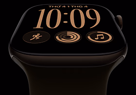 Apple Watch Series 12, aluminum case, dark bronze color, Modular watch face, complications: day and date, Workouts, Activity rings, Apple Music, right side exterior, Digital Crown, Sport Band, olive color